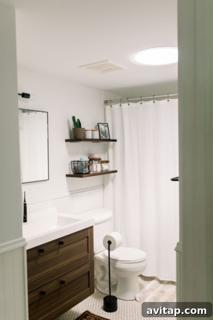 Bright, naturally lit bathroom after VELUX Sun Tunnel installation, showcasing enhanced illumination.