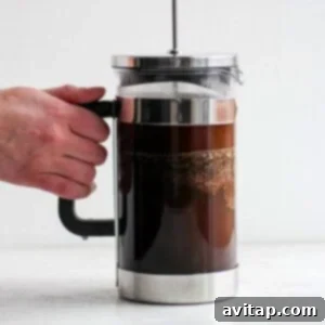 French press coffee brewing, ready to be served.