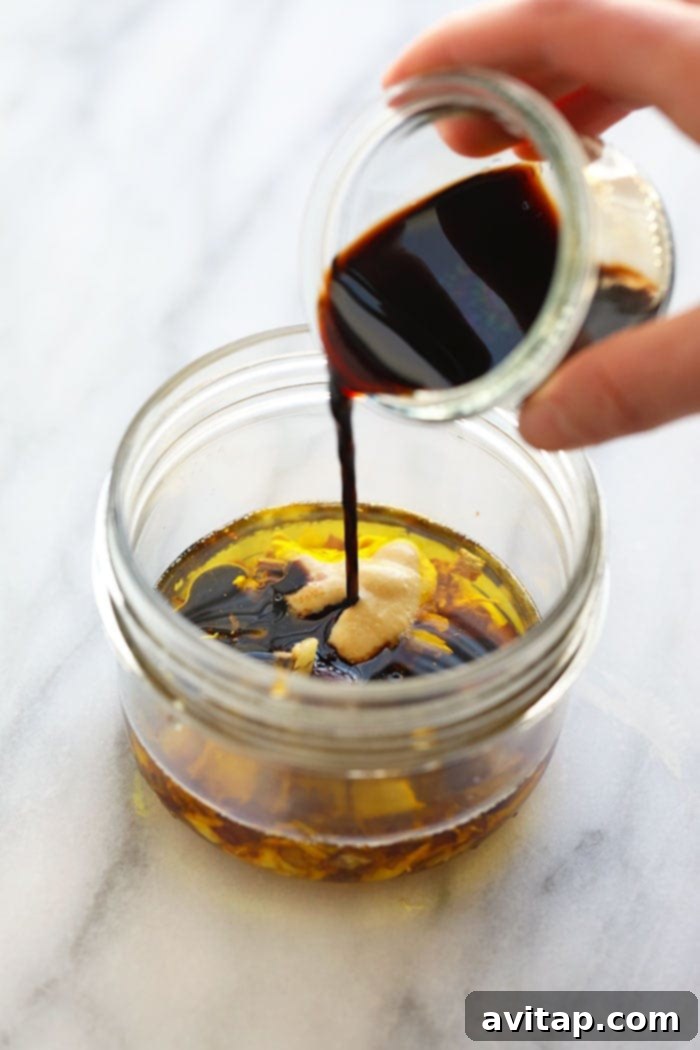 Homemade balsamic vinaigrette dressing stored in a classic mason jar