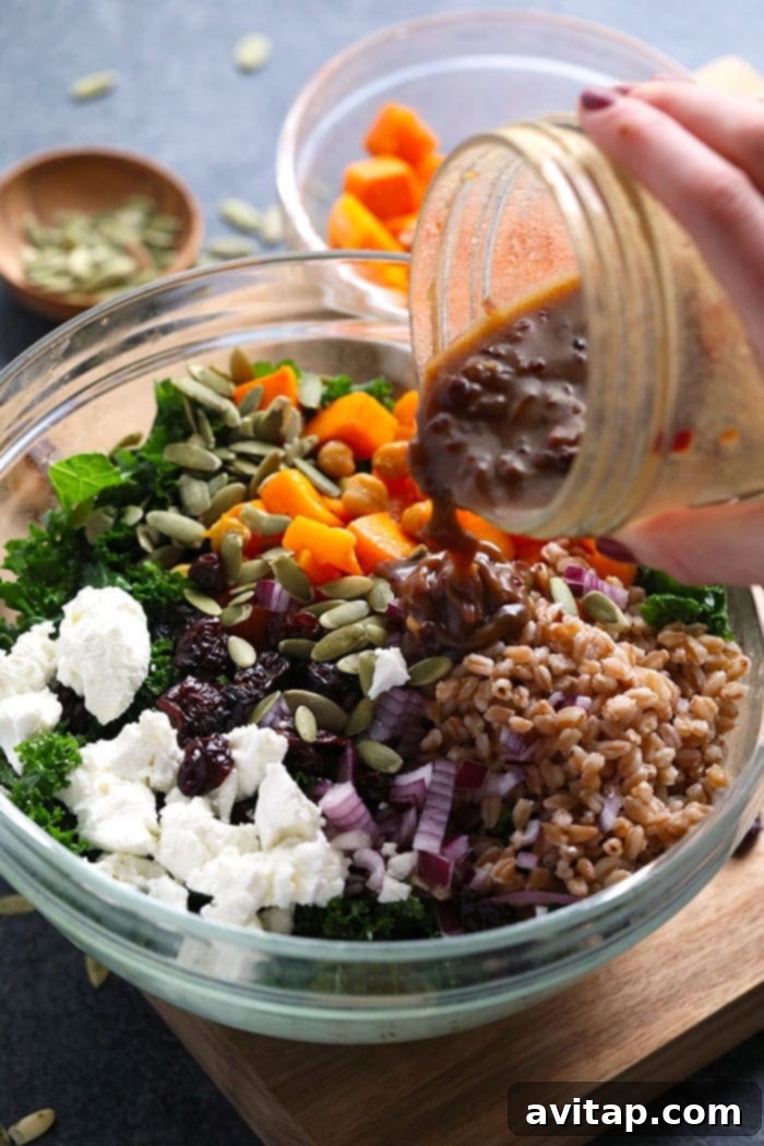 Delicious balsamic vinaigrette dressing being poured over a fresh, vibrant salad