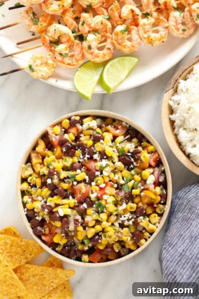 Easy Black Bean and Corn Salad: A versatile and refreshing dish for any occasion. Vibrant Black Bean Corn Salad served in a rustic bowl, garnished with fresh cilantro, ready to be enjoyed.