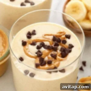Creamy PB Banana Delight 3 peanut butter banana smoothie in glass.