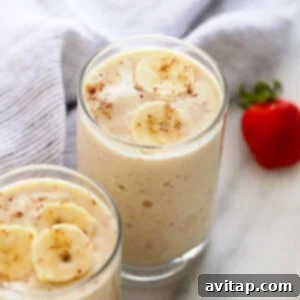 a banana smoothie in a glass, ready to be enjoyed