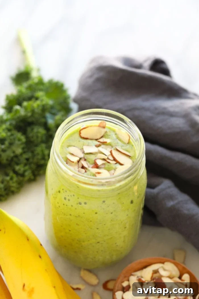 Delicious kale smoothie in a mason jar, garnished for a healthy breakfast or snack.