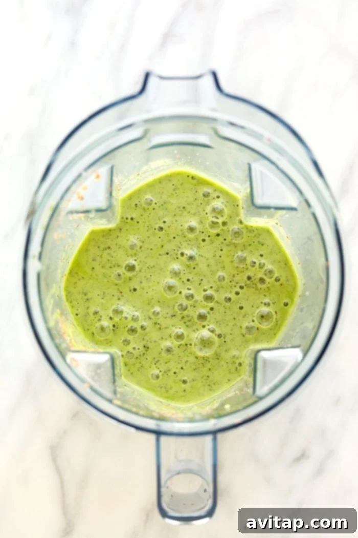 Perfectly blended kale smoothie with a vibrant green color, ready to be served.