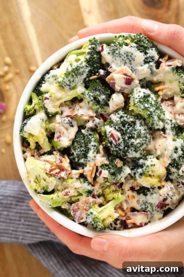A vibrant bowl of healthy broccoli salad with bacon, ready to serve.