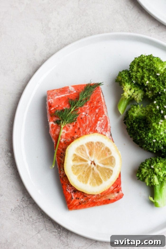 Perfect Sous Vide Salmon Perfectly cooked sous vide salmon fillet served on a plate, garnished and ready to eat.