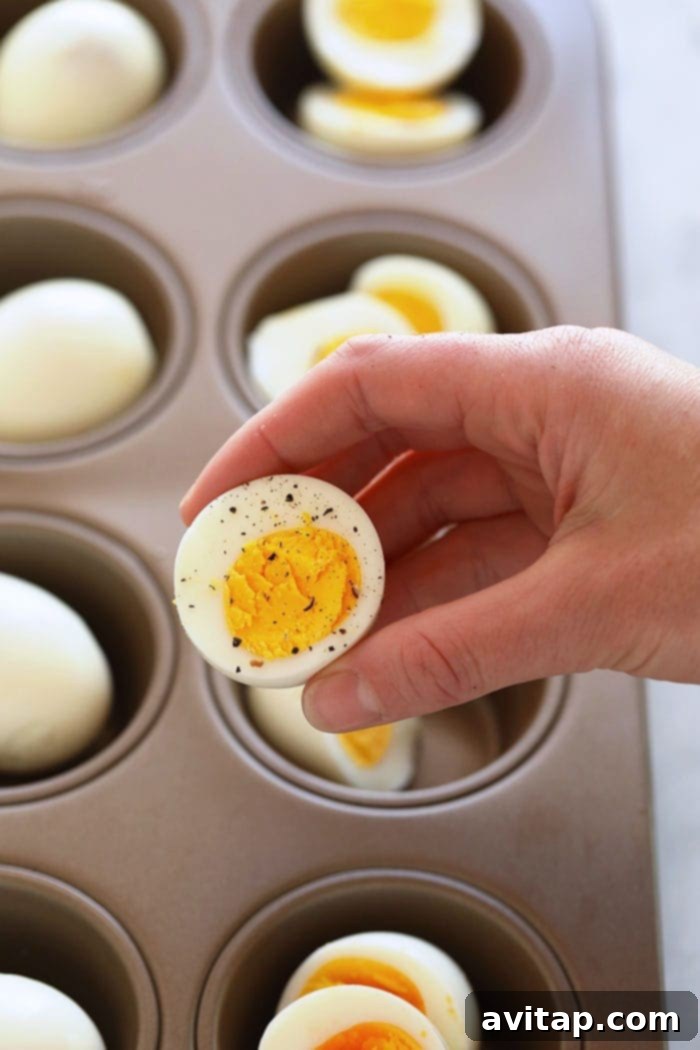 A fresh batch of oven-baked hard-boiled eggs cooling down, perfectly prepared for convenient meal prepping throughout the week.