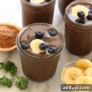 Superfood Protein Smoothie in a glass with toppings.