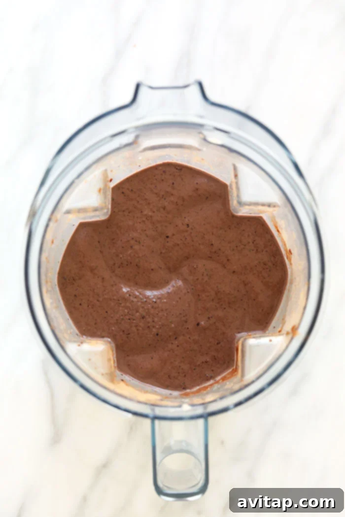 Blending the Perfect Superfood Smoothie Superfood protein smoothie being blended in a high-speed blender.
