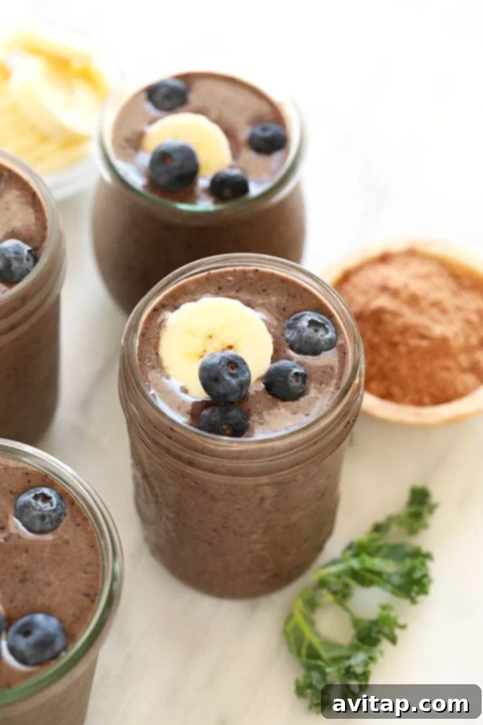 Ready to Enjoy Superfood Smoothie A glass of superfood protein smoothie with a straw.