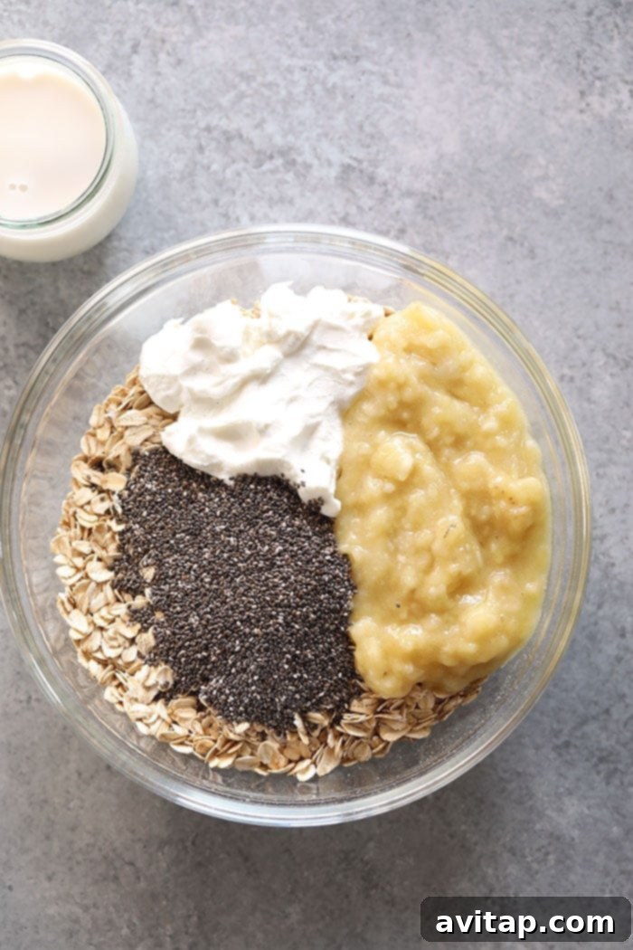 Fresh ingredients ready for your delicious overnight oats. Ingredients for creamy banana overnight oats in a bowl before mixing.