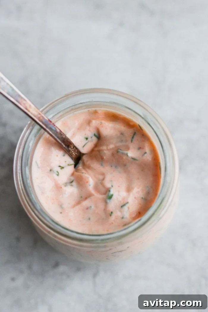 Sriracha aioli for fresh salmon burgers, a creamy and spicy topping.