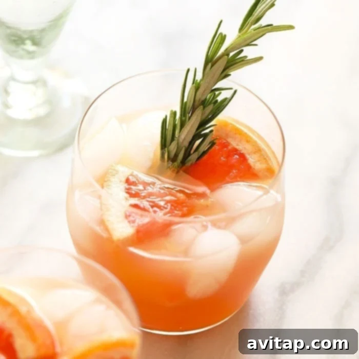 Honey Greyhound Cocktail in a glass with a citrus garnish