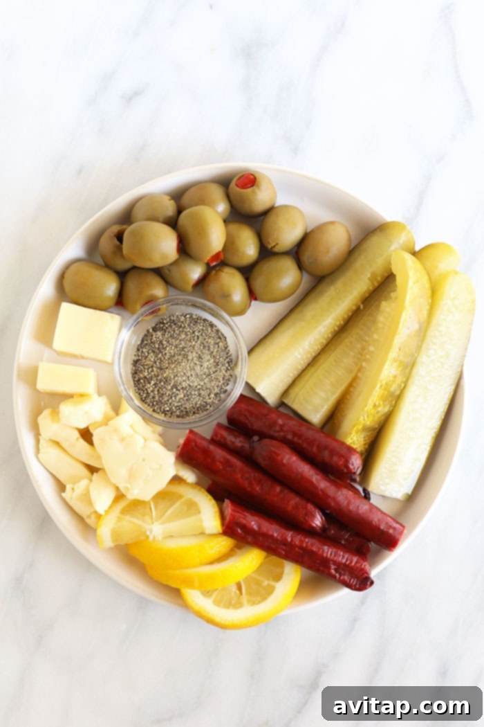 A vibrant assortment of fresh ingredients laid out for crafting a homemade Bloody Mary, including tomato juice, spices, lemons, and garnishes.