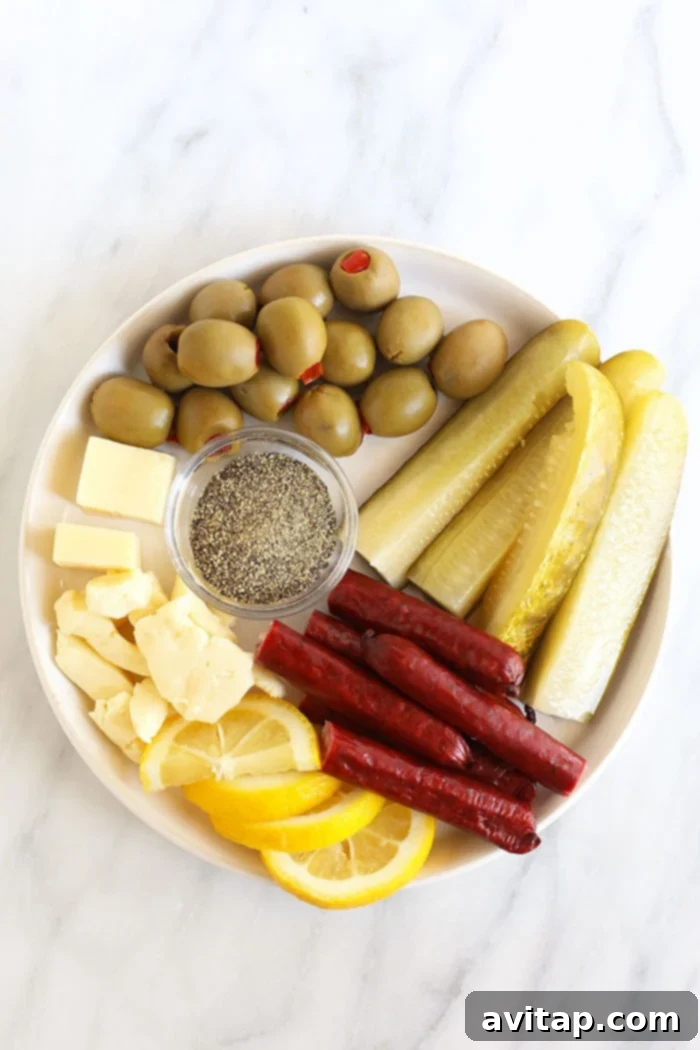 A plate of ingredients for a Bloody Mary recipe, showing tomato juice, vodka, sauces, and garnishes