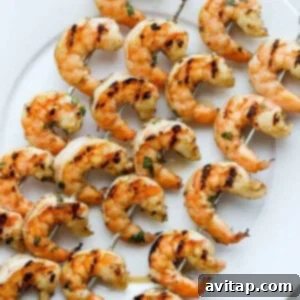 Perfectly grilled pink shrimp on a plate.