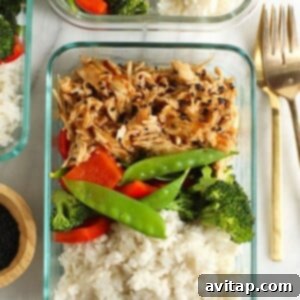 A crock pot dish with teriyaki chicken served over rice, broccoli, and carrots, illustrating a perfect meal prep.