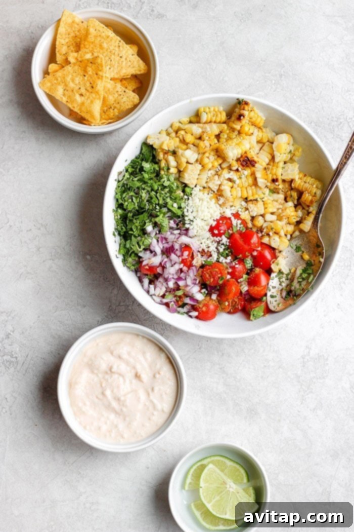 A large bowl of colorful Mexican Street Corn Salad, ready to serve.