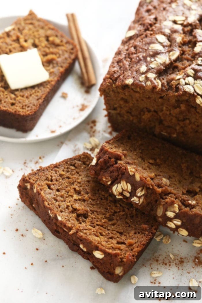 A beautiful loaf of cinnamon apple bread, perfectly sliced and ready to serve.