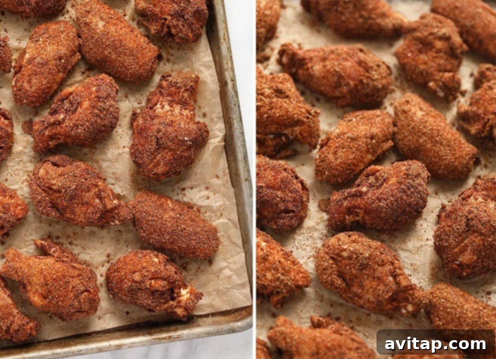 Baked Dry Rub Wings Crispy dry rub chicken wings perfectly baked on a baking sheet, ready to be served.