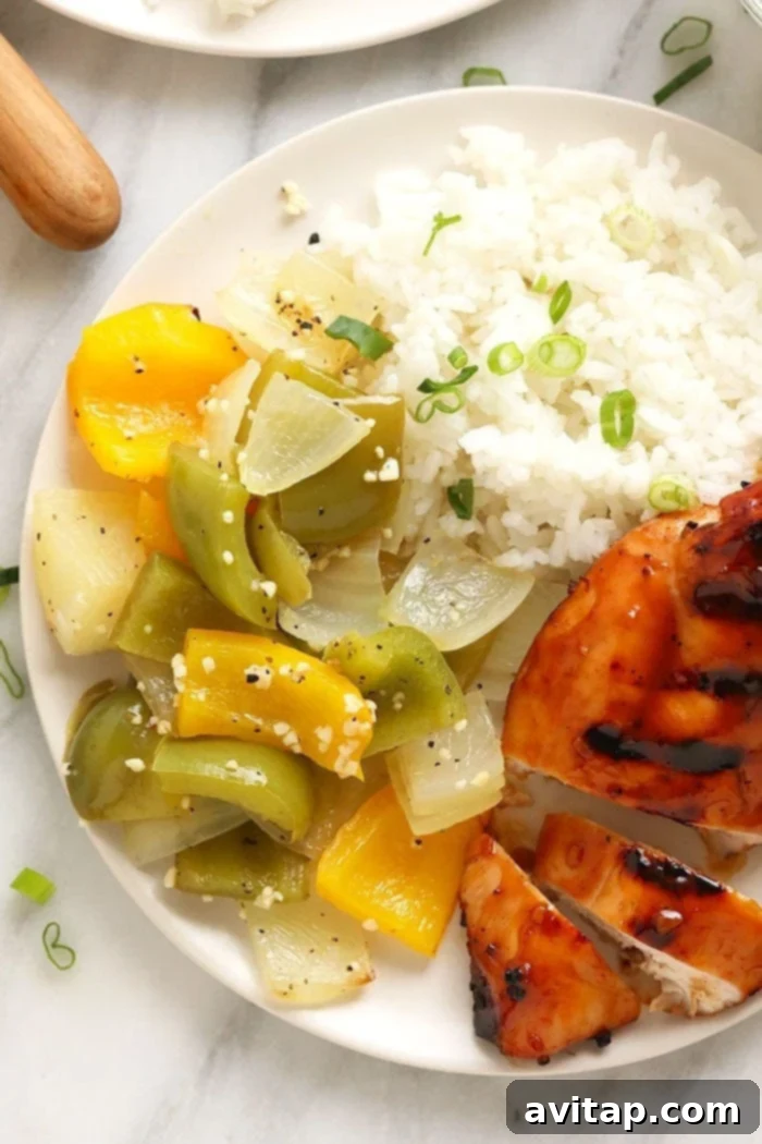 Close-up of tender, smoky grilled peppers and onions served on a plate