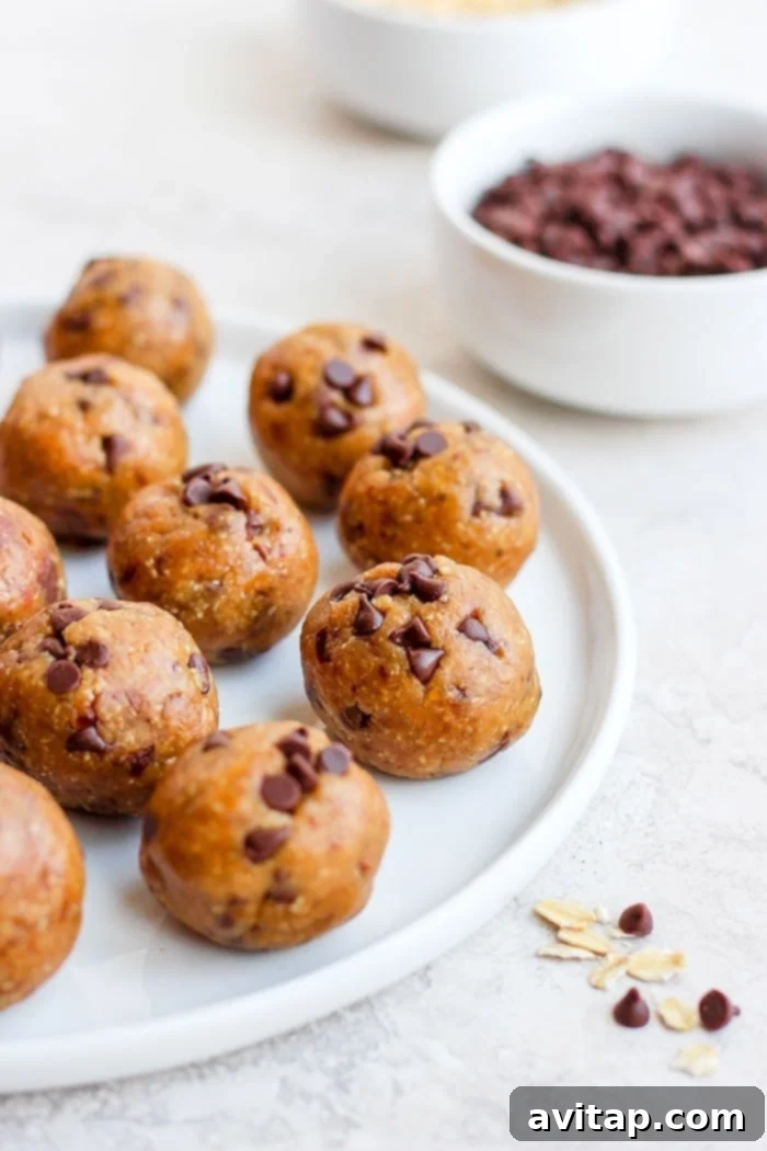 Cookie dough bites artfully arranged on a plate, showcasing their inviting texture and miniature chocolate chips.