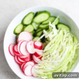 ahi poke bowl with radishes and cucumbers.