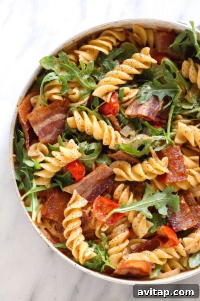 Healthy BLT Pasta: A delicious and wholesome twist on the classic BLT sandwich, perfect for dinner. Healthy BLT Pasta served in a large skillet, garnished with fresh arugula and parmesan cheese
