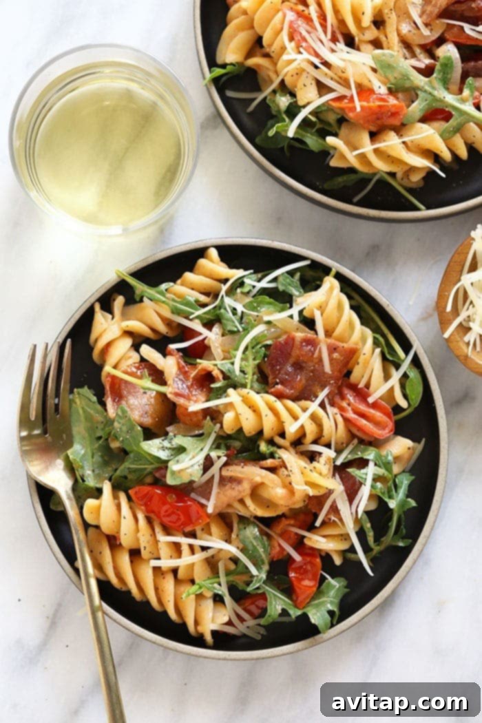 Healthy BLT Pasta, a delightful and wholesome meal plated for enjoyment. A generous serving of Healthy BLT Pasta plated beautifully with fresh herbs, ready to be enjoyed