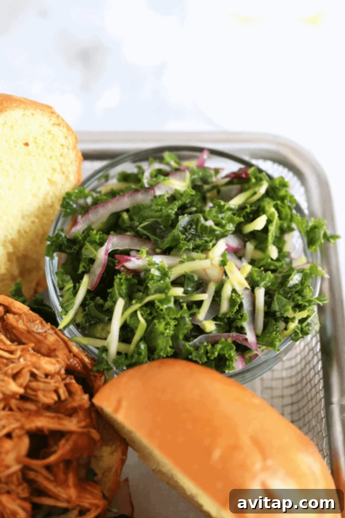 Homemade kale slaw, a perfect topping for pulled chicken sandwiches