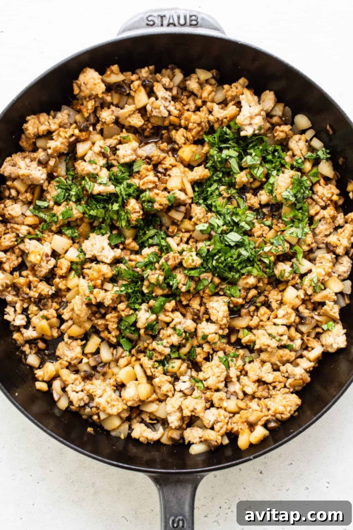 A close-up of the delicious chicken and vegetable filling for lettuce wraps, showing its rich texture and colors.