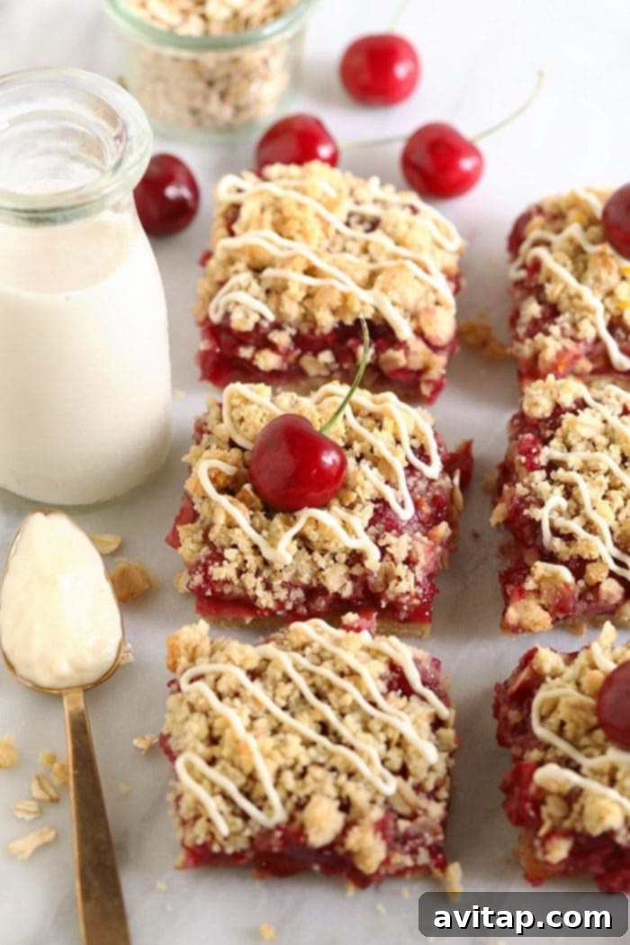 Make these cherry cobbler bars the next time you need a little sweet treat! These cherry cobbler bars are made with fresh cherries and a delicious almond flour crust. Have no fear, cherry season is here! Delicious cherry cobbler bars on a rustic cutting board, showcasing a golden almond flour crust and vibrant cherry filling.