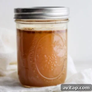 Homemade Chicken Broth: Elevate Your Soups Homemade Chicken Broth in a glass jar.
