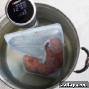 Sous vide pork tenderloin cooking with a digital thermometer.