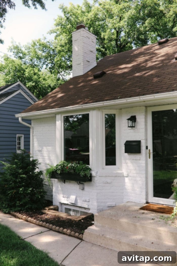 White brick house with sophisticated black and charcoal accents