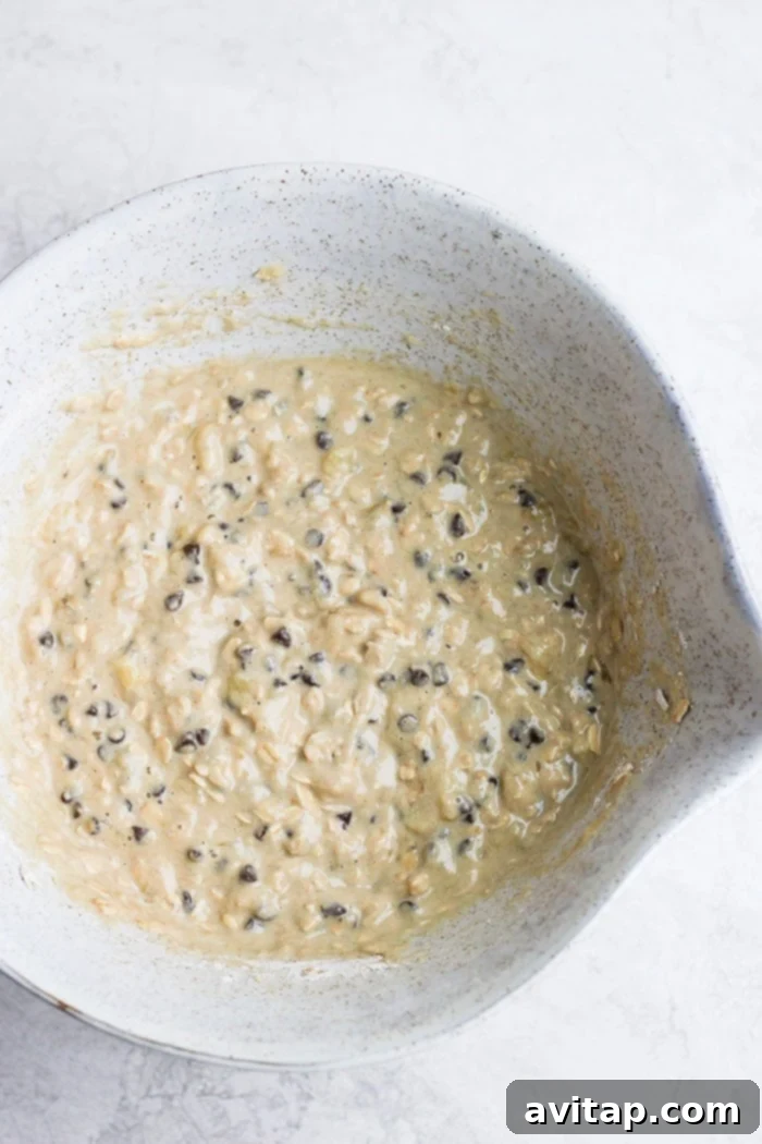 Perfectly Mixed Healthy Pancake Batter Close-up of a bowl filled with healthy chocolate chip pancake batter, showing a thick, creamy consistency ready for cooking