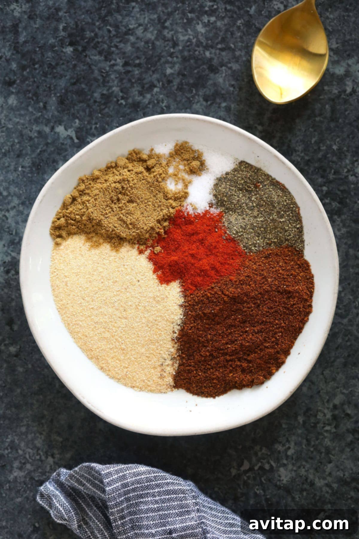 Individual chili spices laid out on a plate