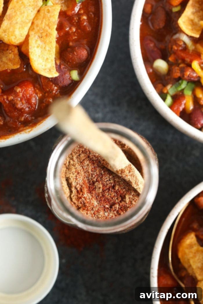Homemade chili seasoning stored in a glass jar, ready for use.