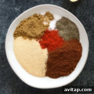 Chili spices on a plate, ready to be mixed for homemade seasoning.
