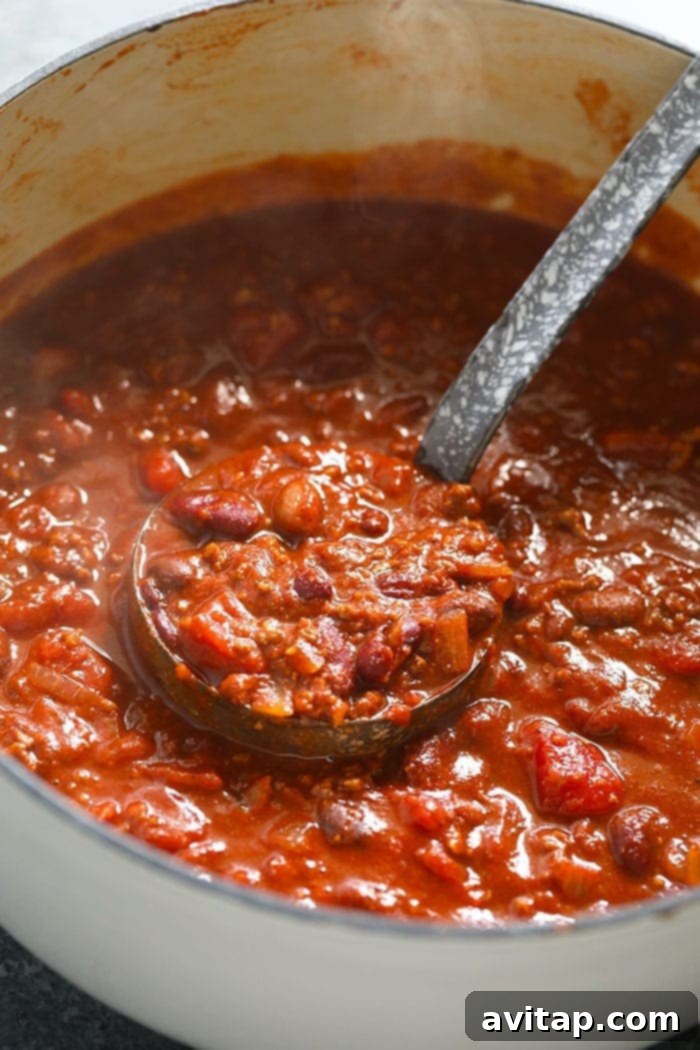 A large stockpot brimming with the best beef chili recipe, ready to serve.