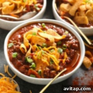 Three bowls of the best chili, served with tortilla chips.