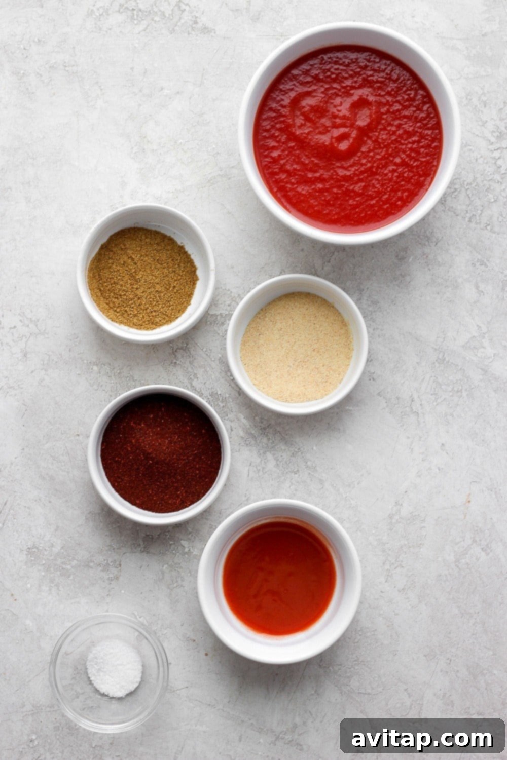 Collection of fresh ingredients for homemade enchilada sauce recipe