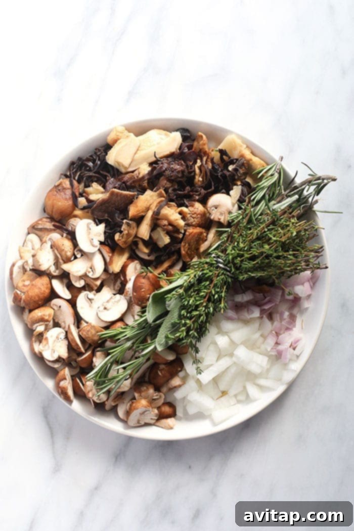 All the fresh and essential ingredients for making delicious homemade mushroom gravy laid out neatly on a white plate, ready for cooking.