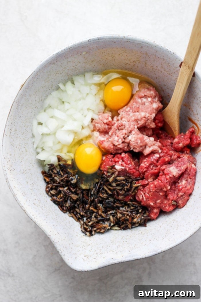 Ingredients for Wild Rice Meatloaf in a bowl, ready to be mixed