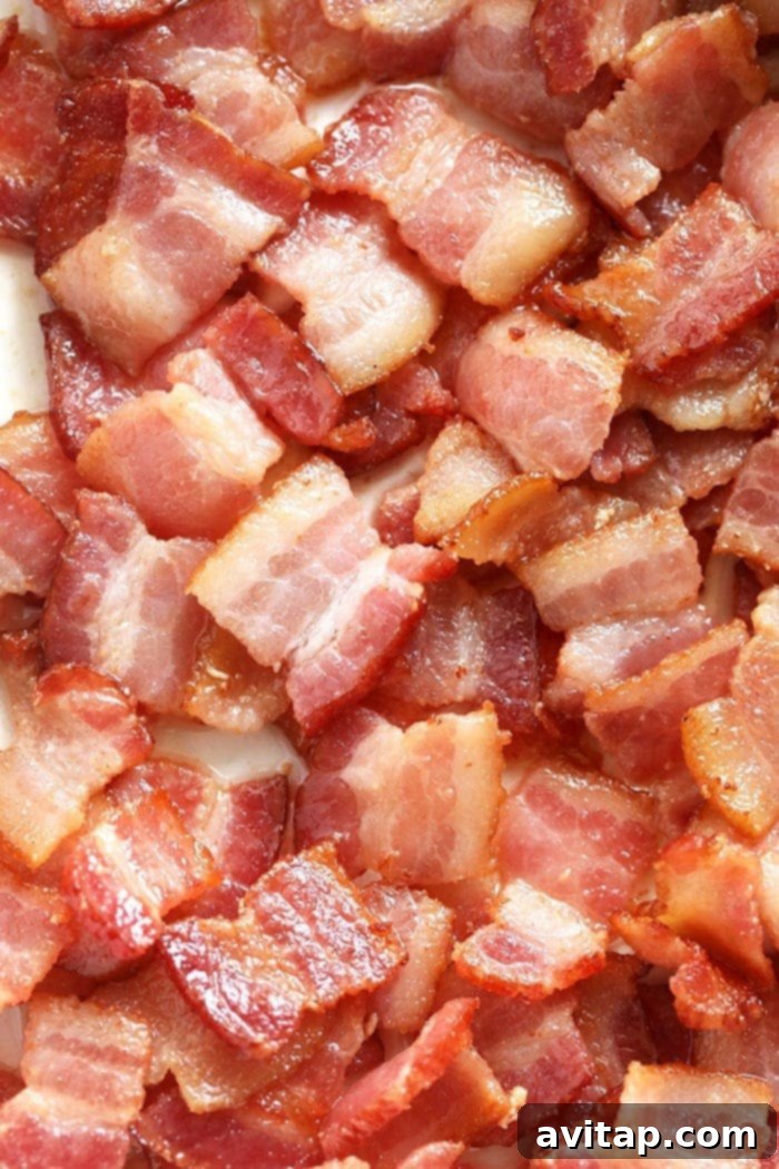 Close-up shot of perfectly cooked, glossy bacon bits, showcasing their irresistible texture and maple glaze.