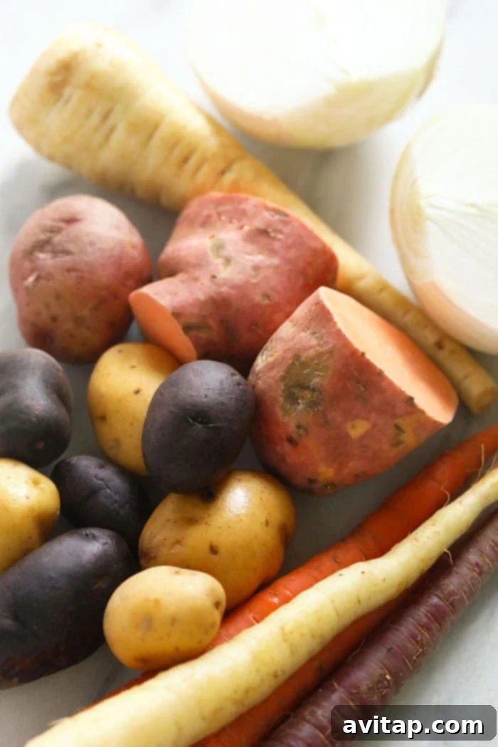 Golden Roasted Root Medley 3 Raw root vegetables on a cutting board, ready for preparation