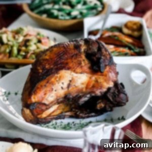 Perfect Sous Vide Turkey 6 Thanksgiving dinner with Sous Vide turkey and roasted vegetables on a table.