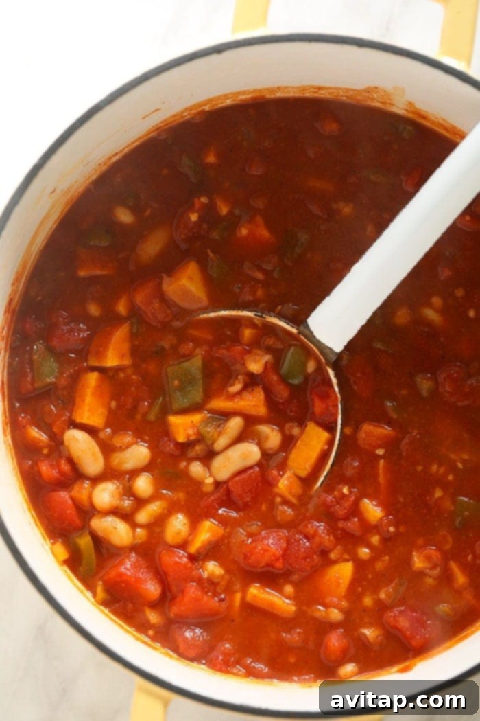 Vegetarian Chili in a large stockpot Vegetarian chili simmering to perfection in a large stockpot on the stove.