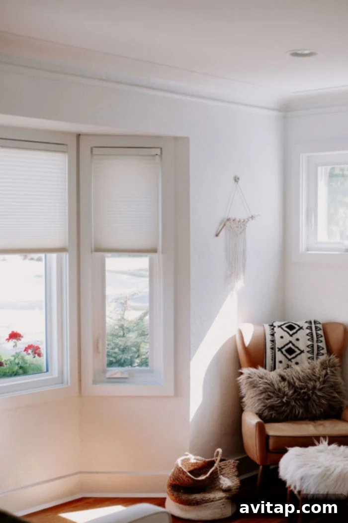 Close-up view of elegant white custom blinds installed in a residential window, highlighting their pristine appearance and modern design.